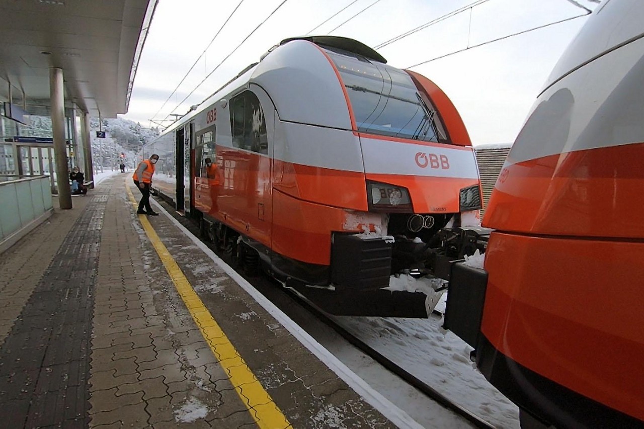 Modern ÖBB regional train set on the Mattig valley railway line in winter